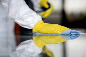 A person cleaning a surface